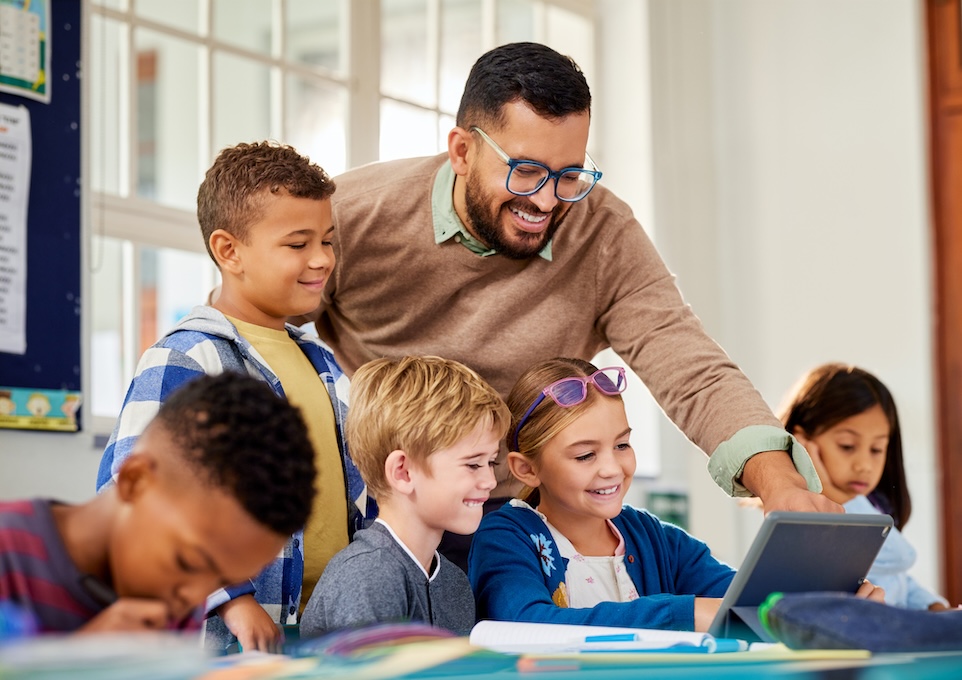 male teacher with elementary age children